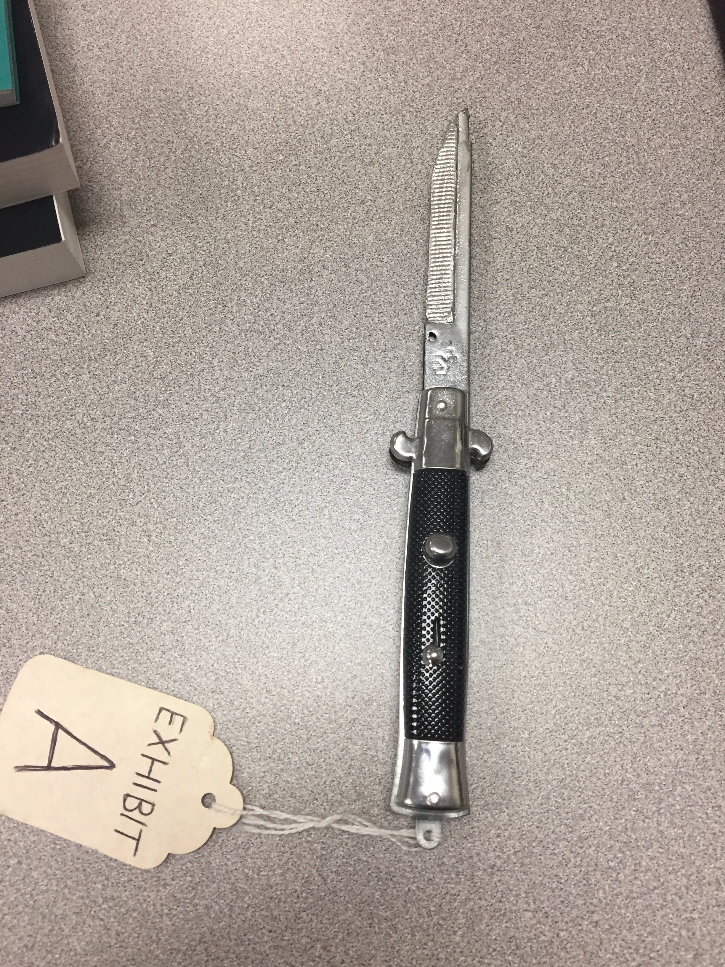 prop switchblade made from comb